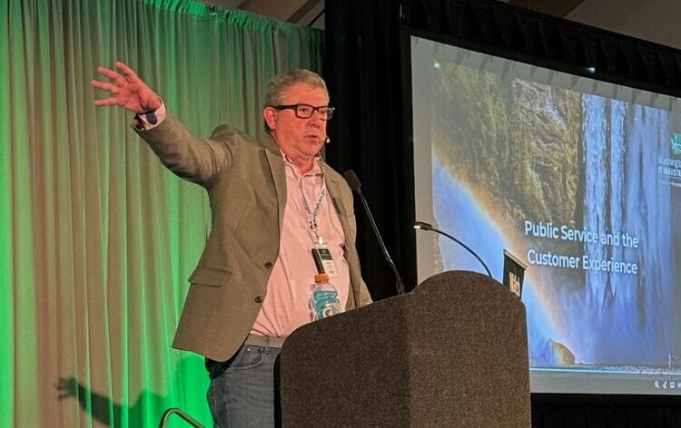 Bill Kehoe delivers keynote address at podium